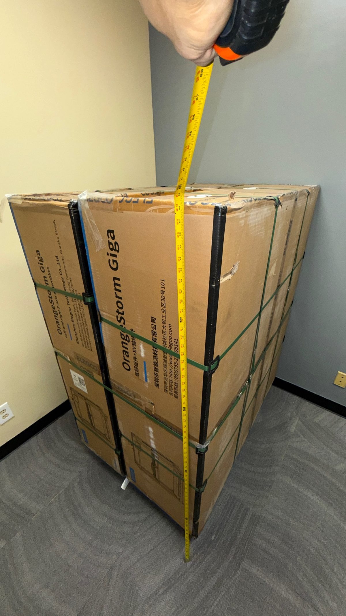 Tape measure against the finished OrangeStorm Giga pallet showing the total height is only 59 inches