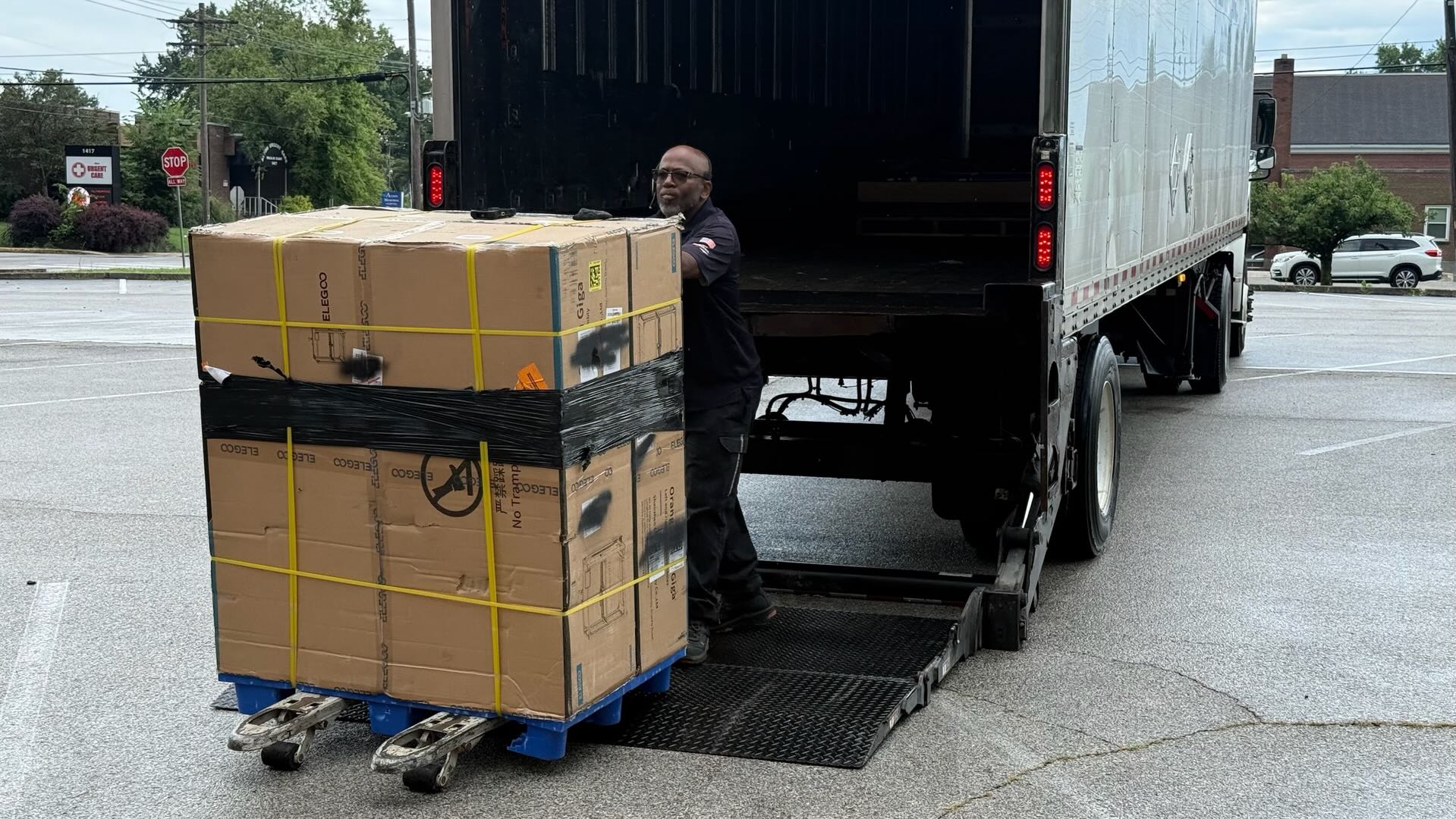 Secured upright OrangeStorm Giga pallet being loaded by liftgate